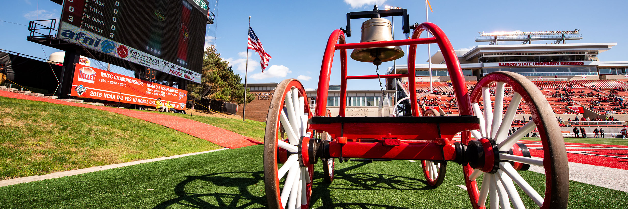 An image of the victory bell on the football field