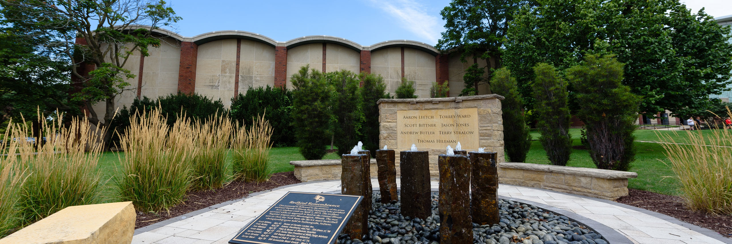 A memorial plaque sits in front of 7 monuments in rememberance of the Redbird 7.