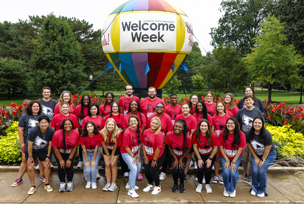 group of students in front of hot air balloon